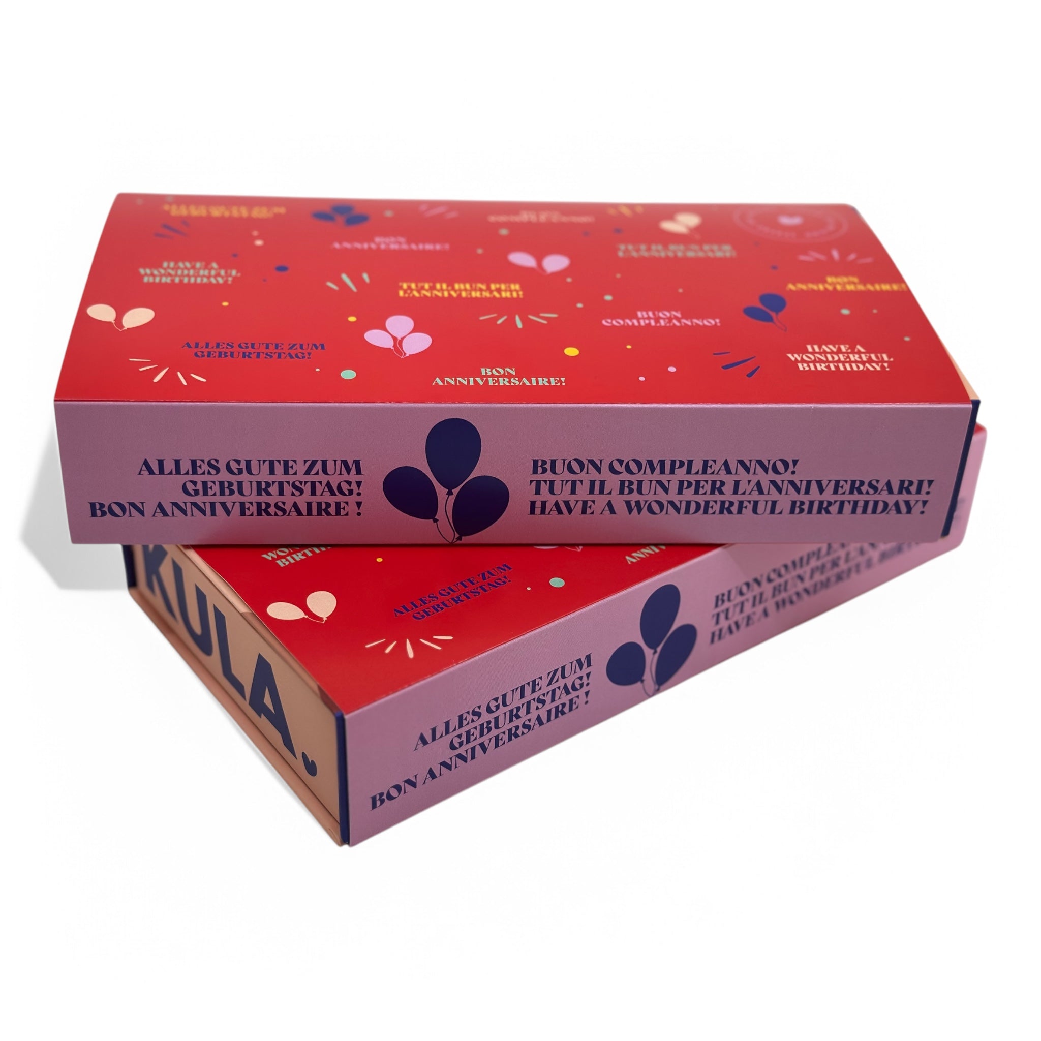 KULA gift box with a vibrant red 'Happy Birthday' sleeve in multiple languages, perfect for celebrating birthdays. Thoughtful brownie gift box featuring Swiss-made treats for any birthday celebration
