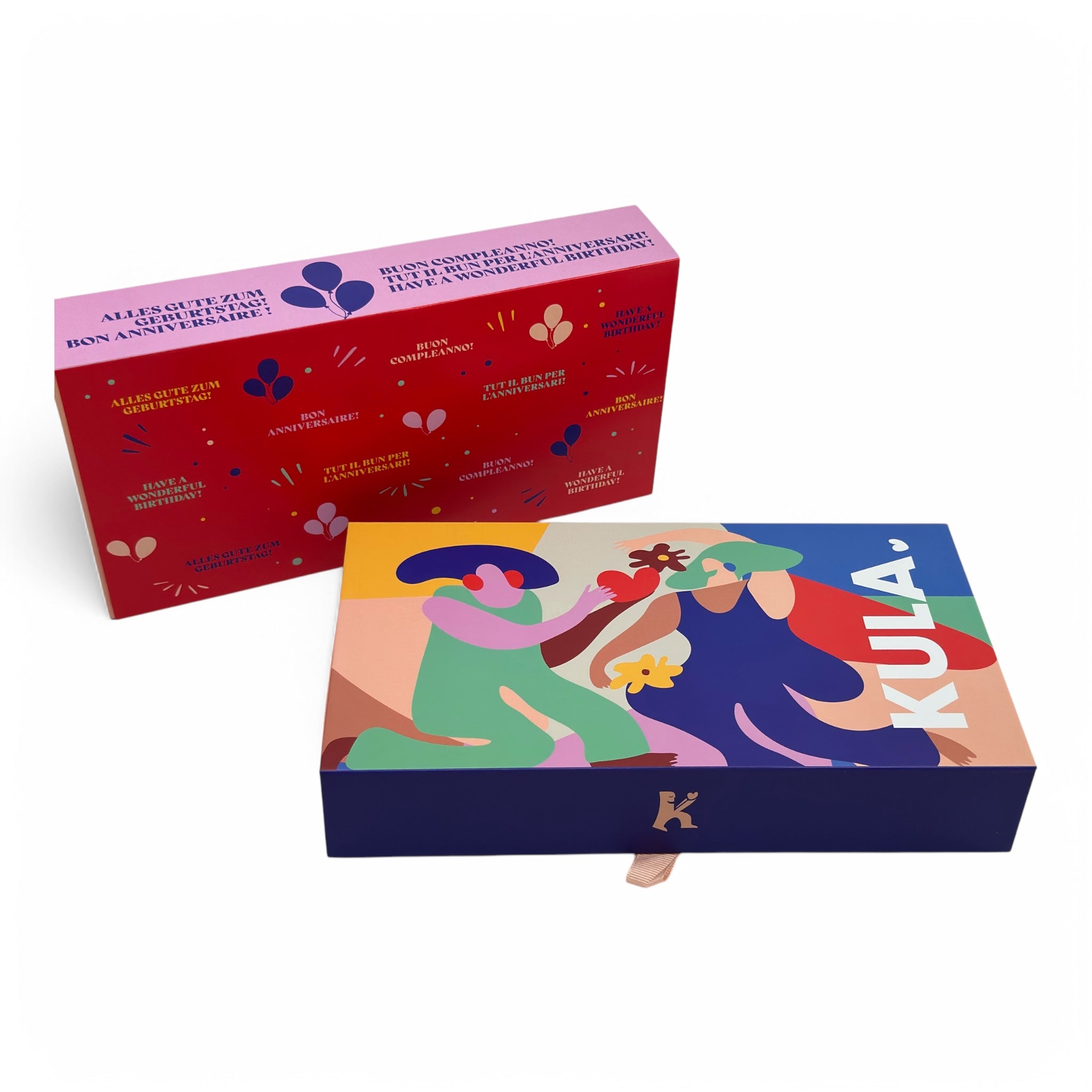 KULA birthday gift box featuring a vibrant red 'Happy Birthday' sleeve in multiple languages, paired with the signature KULA box. A thoughtful Swiss brownie gift to celebrate special occasions.