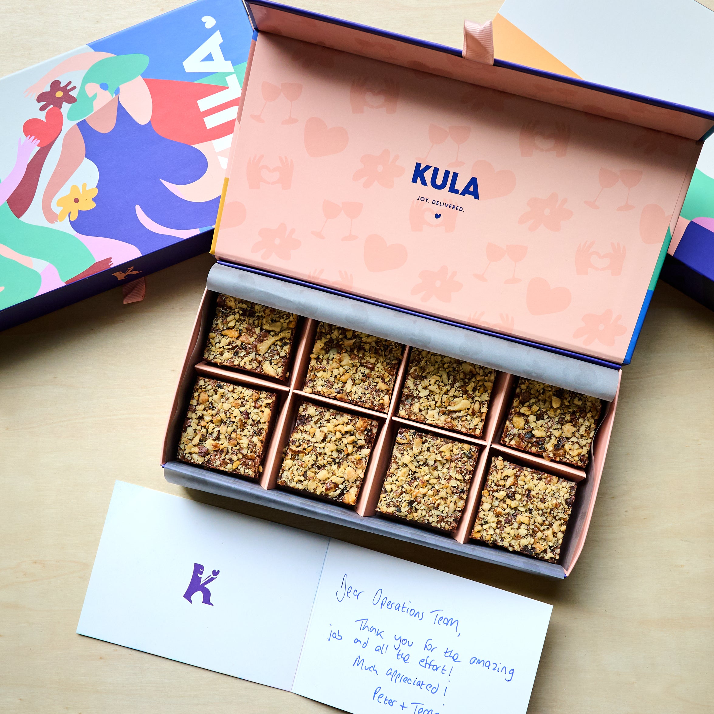 Vibrant KULA magnetic gift box with 8 nutty brownies and handwritten message
