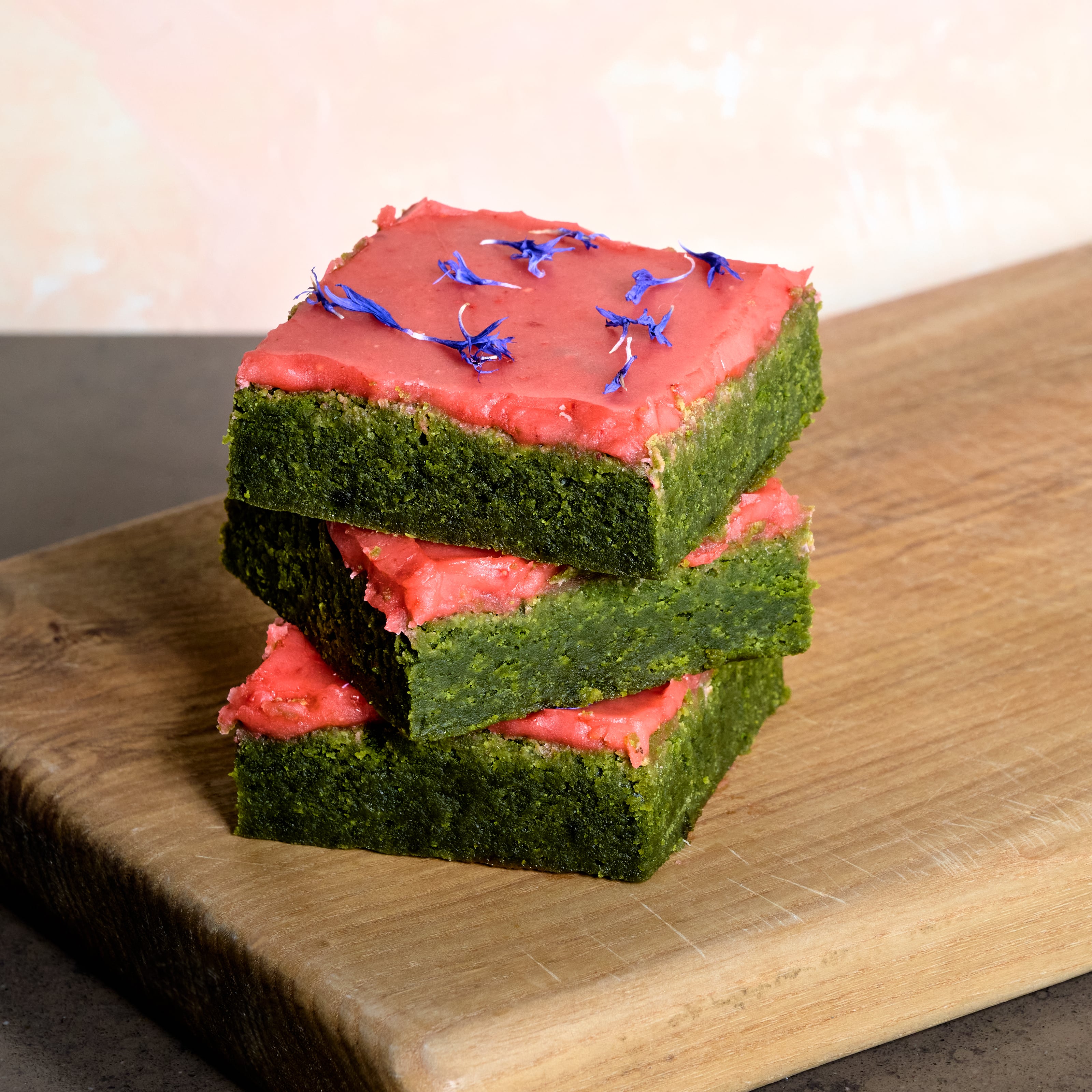 KULA matcha brownie with premium Sayaka Matcha and a strawberry glaze with edible purple flowers. 