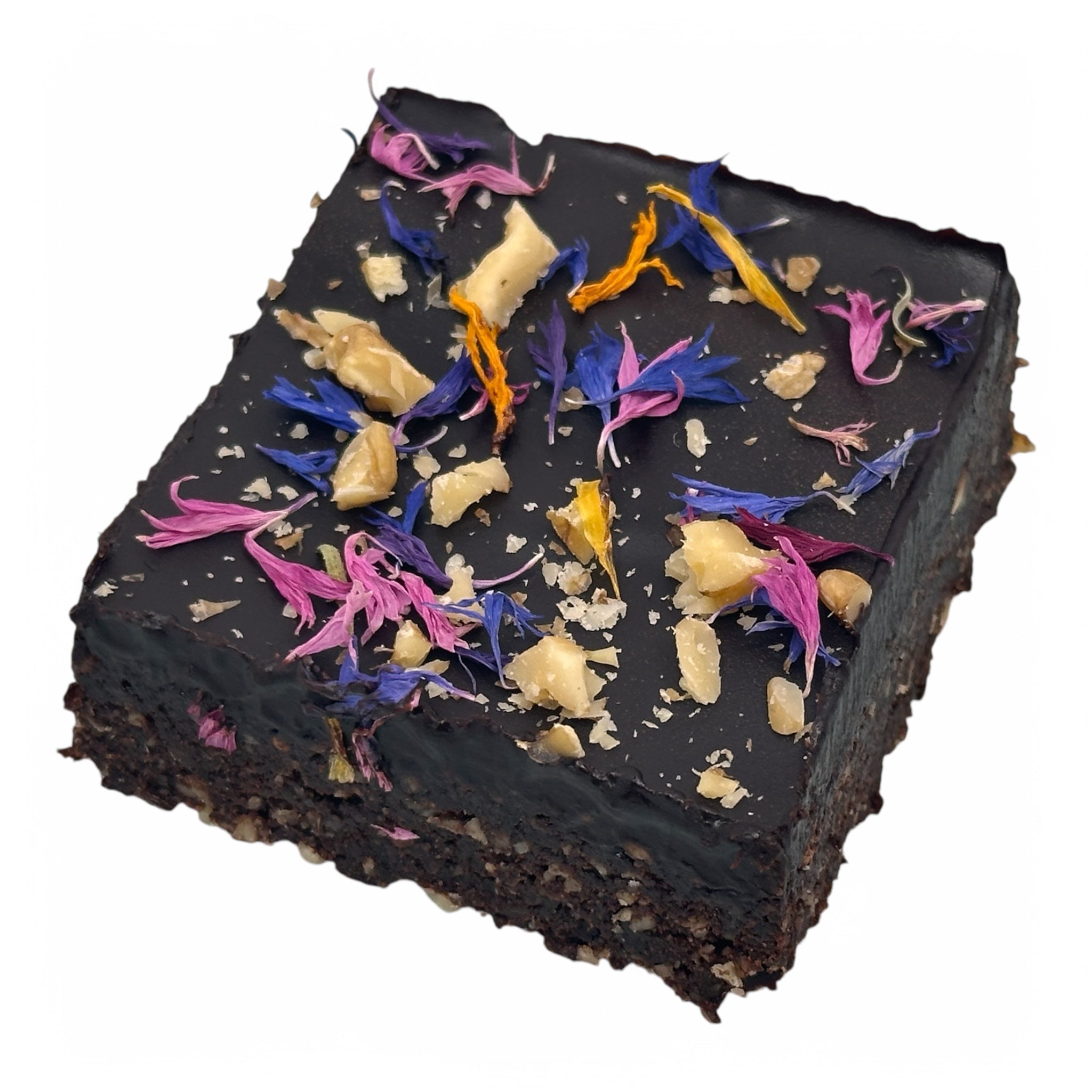 A single plant-based raw vegan brownie slice topped with colourful edible flowers and chopped nuts. The rich, chocolatey brownie base is perfectly complemented by its vibrant and natural toppings, showcasing a visually stunning and delicious treat.